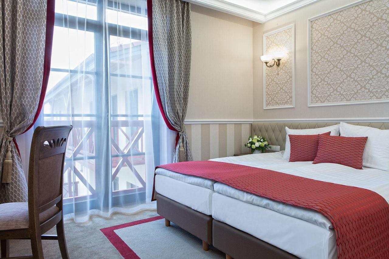 Boutique Odyseja & Spa Цехоцинек Екстериор снимка A room at the hotel